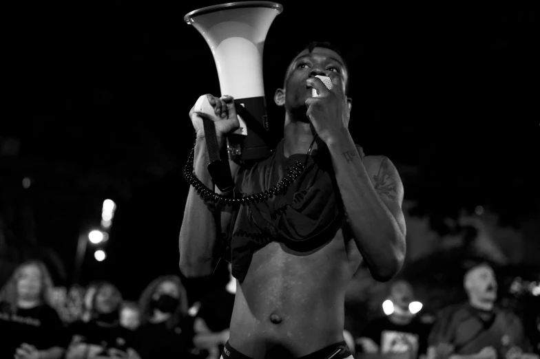 a person drinking a beverage from a large glass