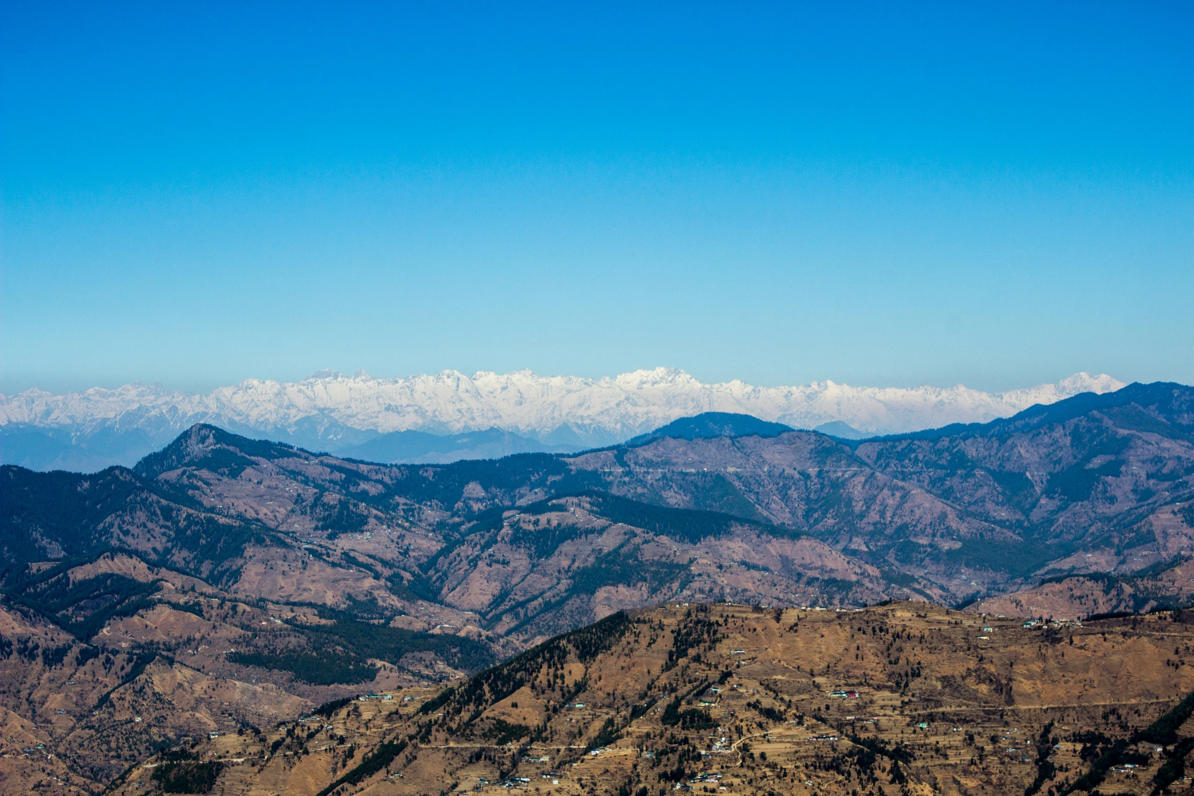 the mountain top with hills in the background