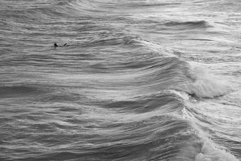 a surfer riding a wave in the ocean