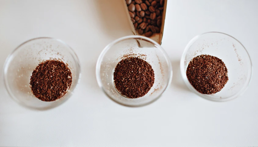 two bowls with powdered chocolates sit next to each other