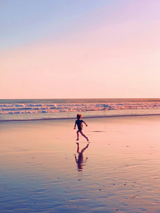 two people on the beach near the ocean