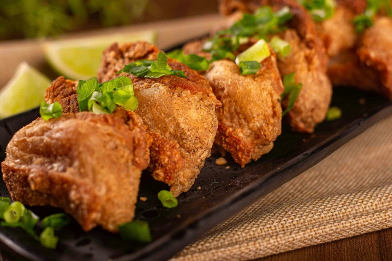 a very tasty looking plate of meat with green garnish