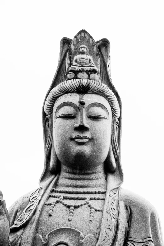 the statue of a buddha in black and white