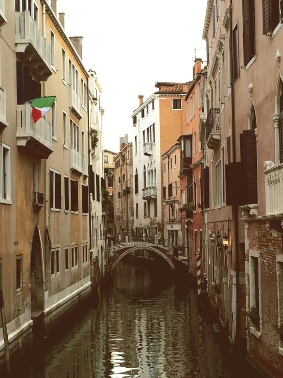 a canal running through a city filled with tall buildings