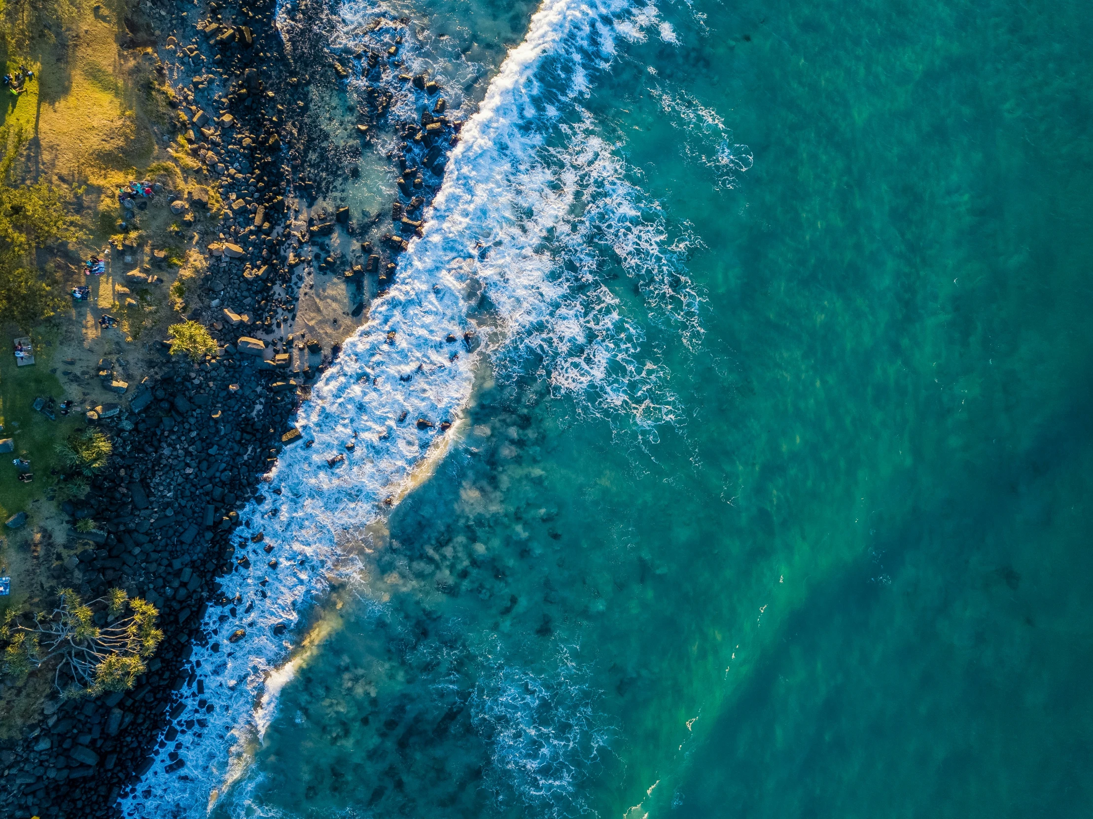 two surfboards sitting on top of the ocean