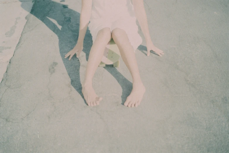 a girl lies down on the ground with her legs up