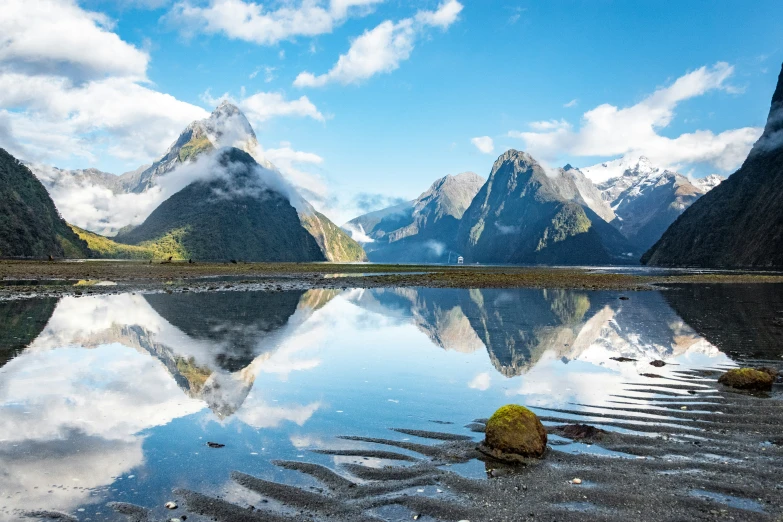 the reflection of mountains in water