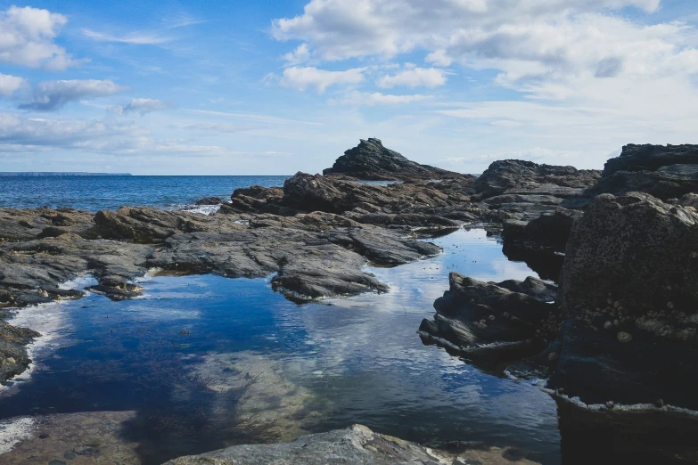 large rocks with water in the middle of them