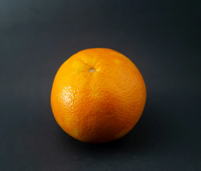 an orange sitting on top of a table