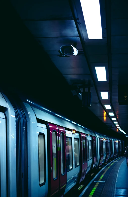 train moving through a train station near people