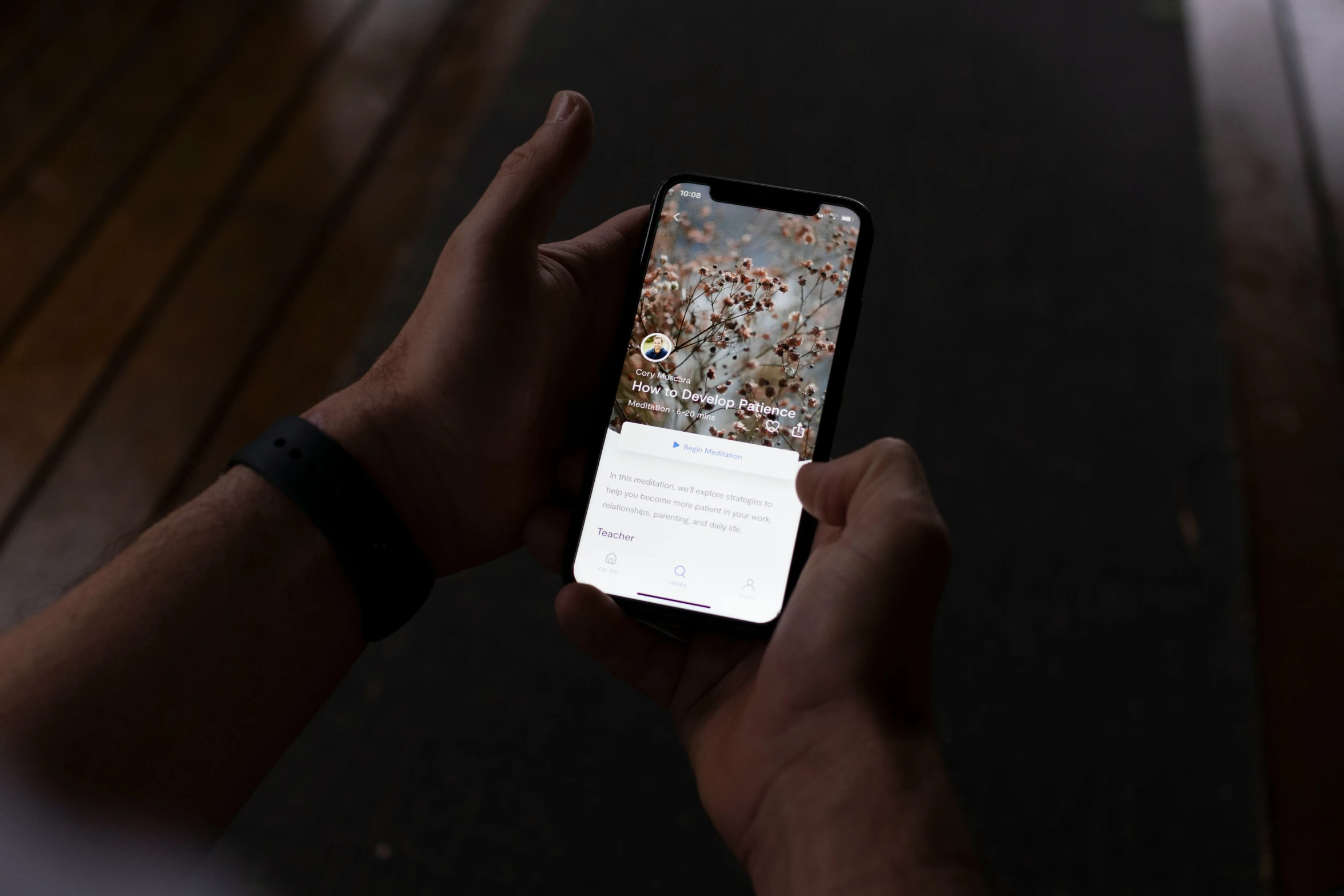 someone holds a cellphone with a message in it