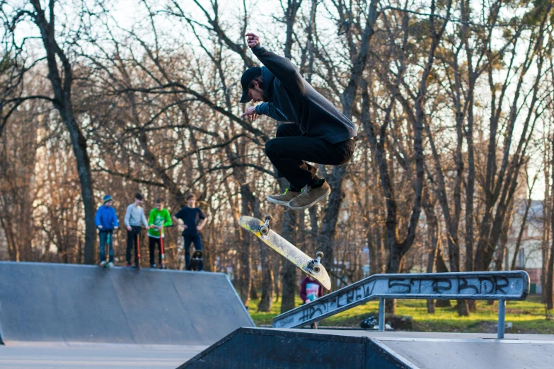 a man riding a skateboard up the side of a ramp