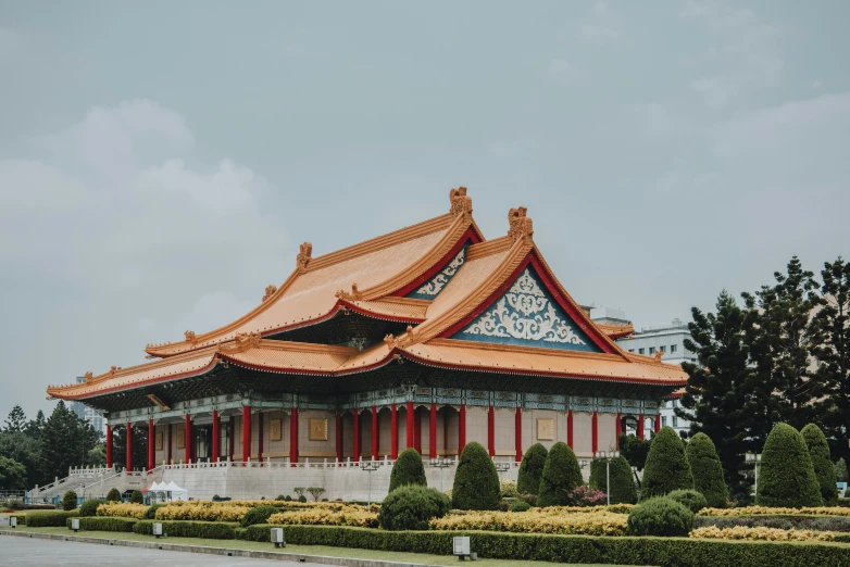 the exterior of the chinese temple has red and blue trim