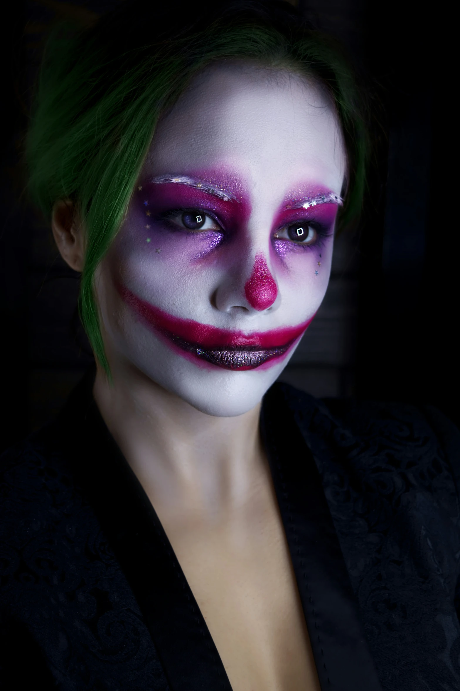 a woman with purple makeup, green hair and green hair