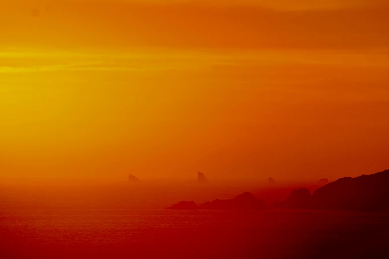 an airplane is flying into the sun set