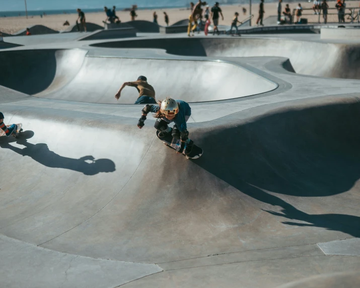 skateboarders practicing in the outdoor skate park