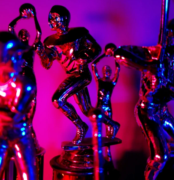 two shiny statues of the human body are shown