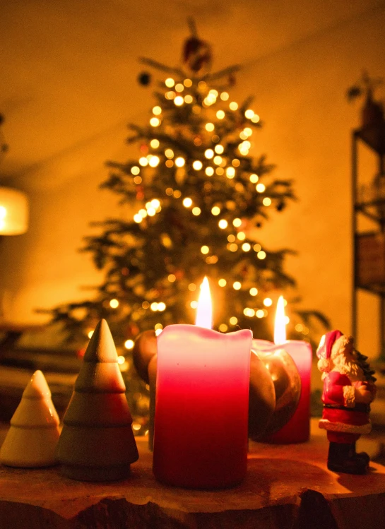 there is an arrangement of candles on the table