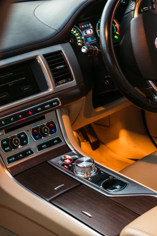 a car dashboard with a clock and electronic devices