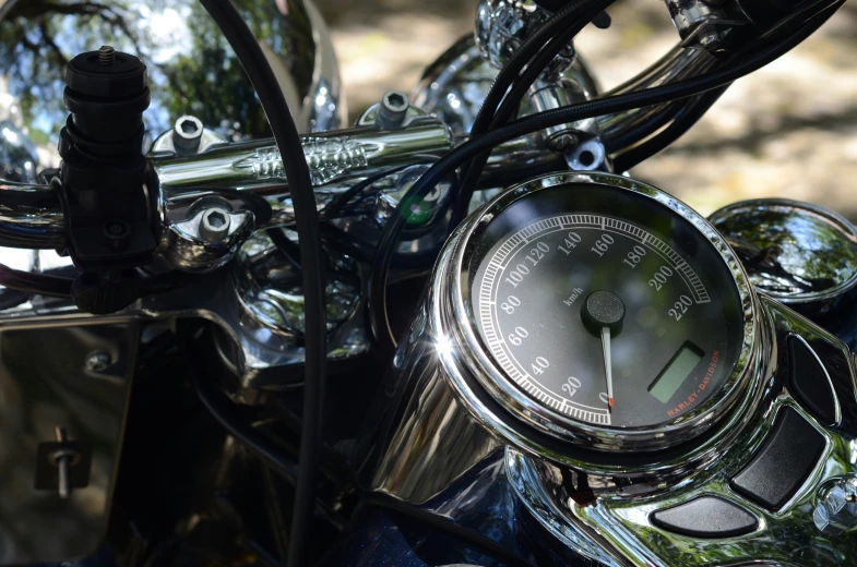 a clock is attached to a motorcycle handlebar