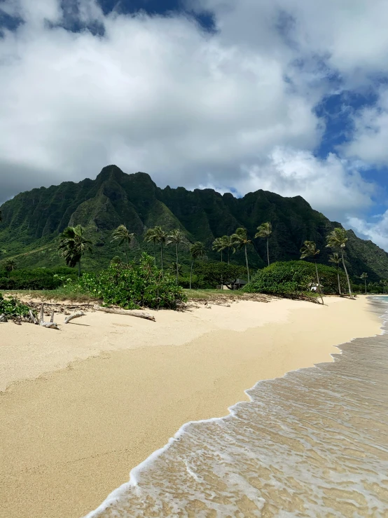 a beautiful view of the ocean near a mountain