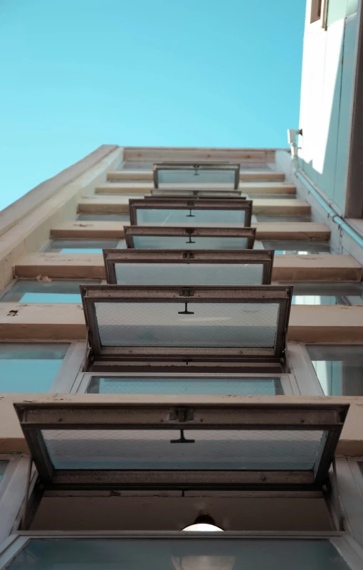 an exterior image of an apartment building with sky in the background