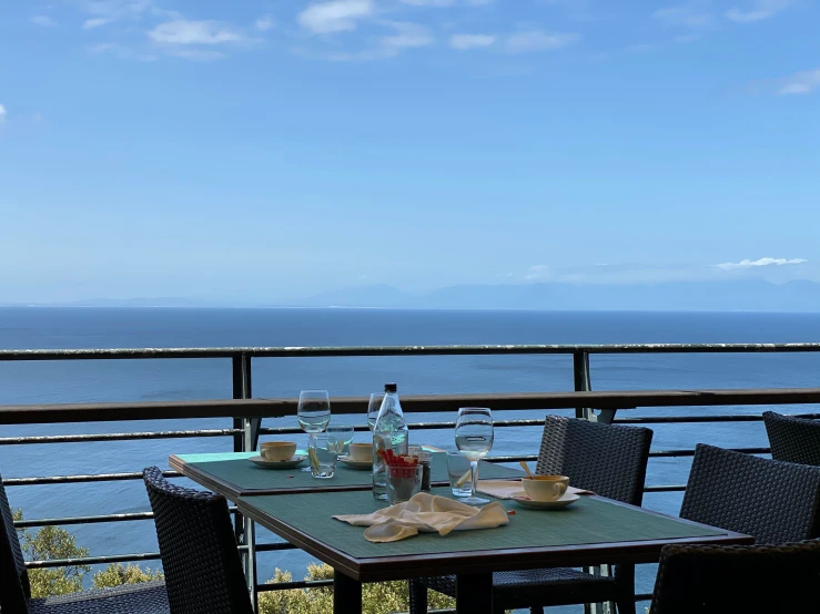 a table with food is near a big ocean