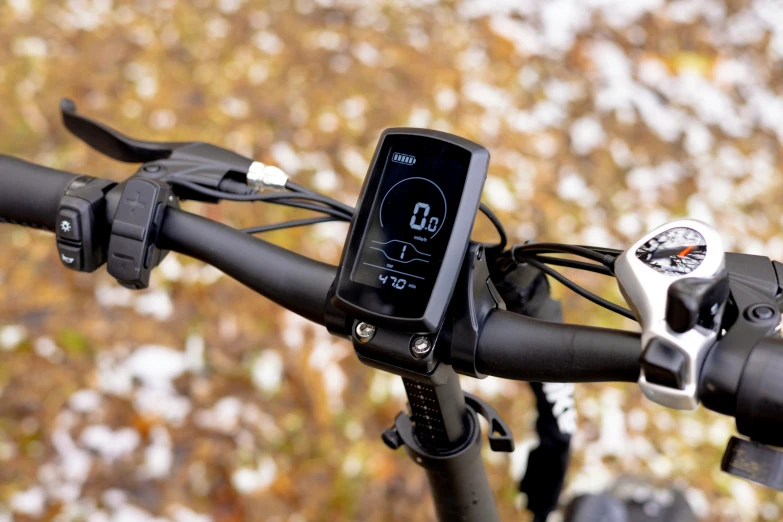 a cell phone mounted to the handle bars of a bike