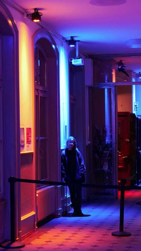 a person standing at the entrance of a building