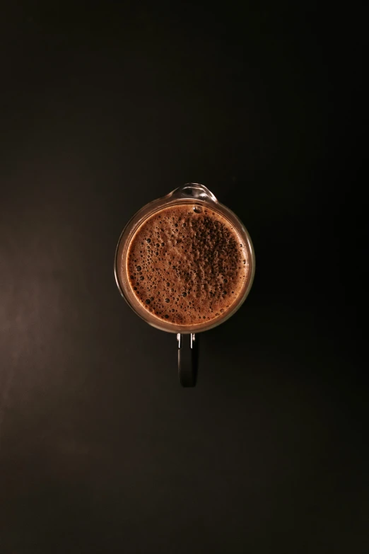 an overhead view of a glass container with some grain