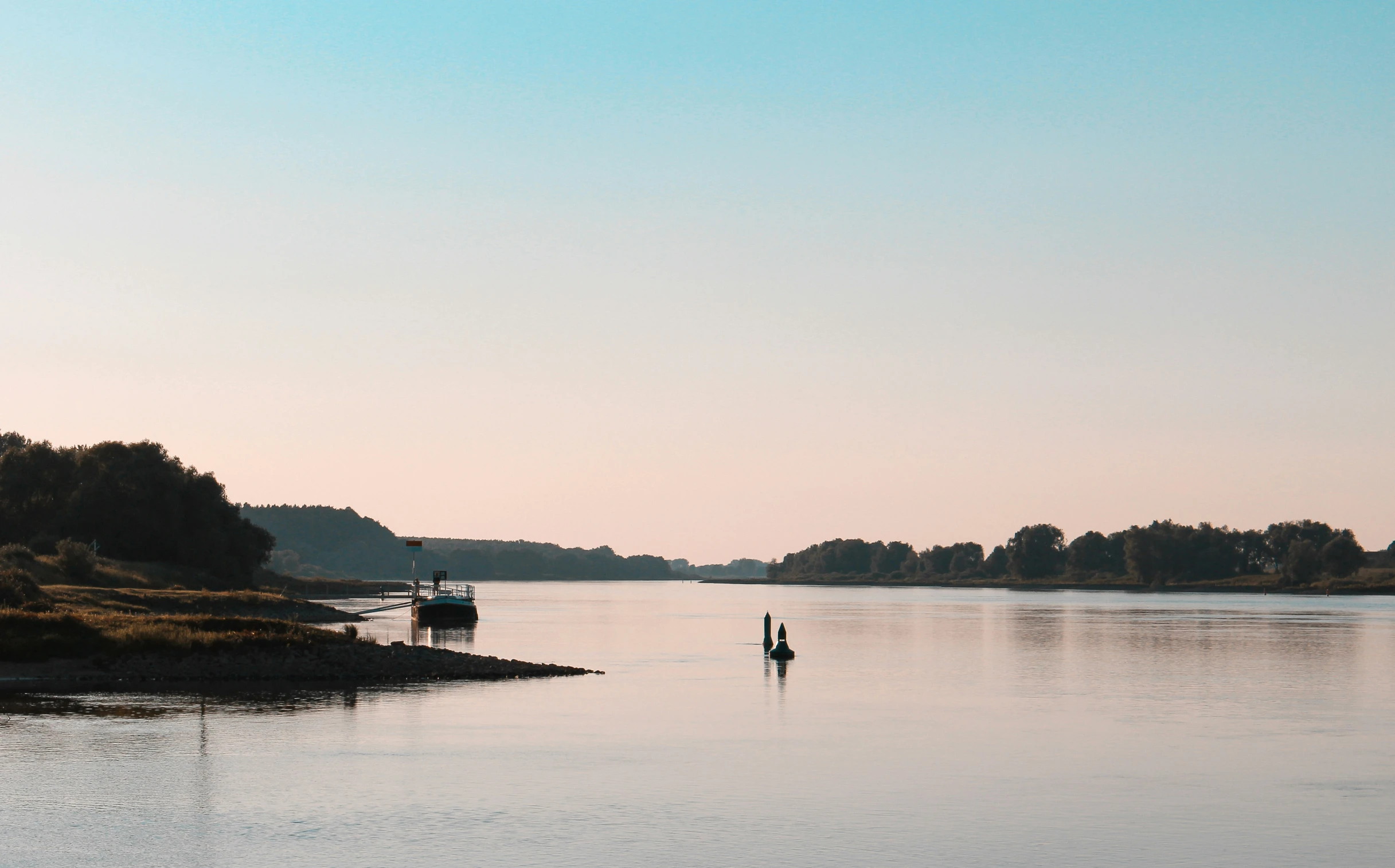 two people on boats out on the water