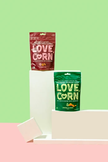 three bags of love corn are on display