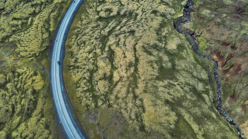 an aerial view of a long, blue highway