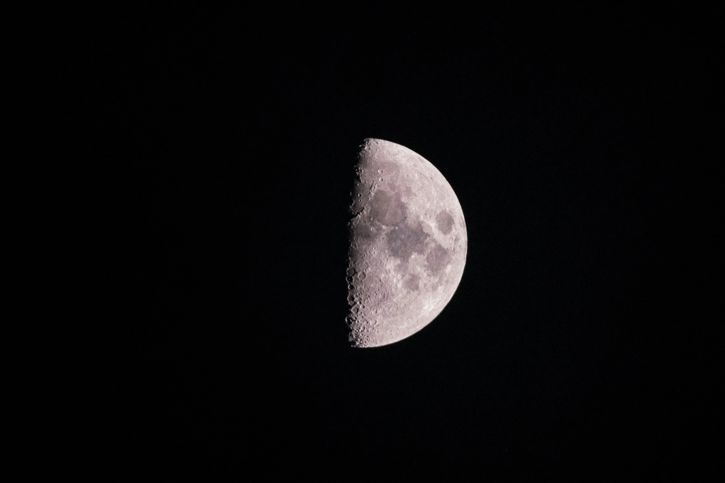 the moon in the dark sky at night