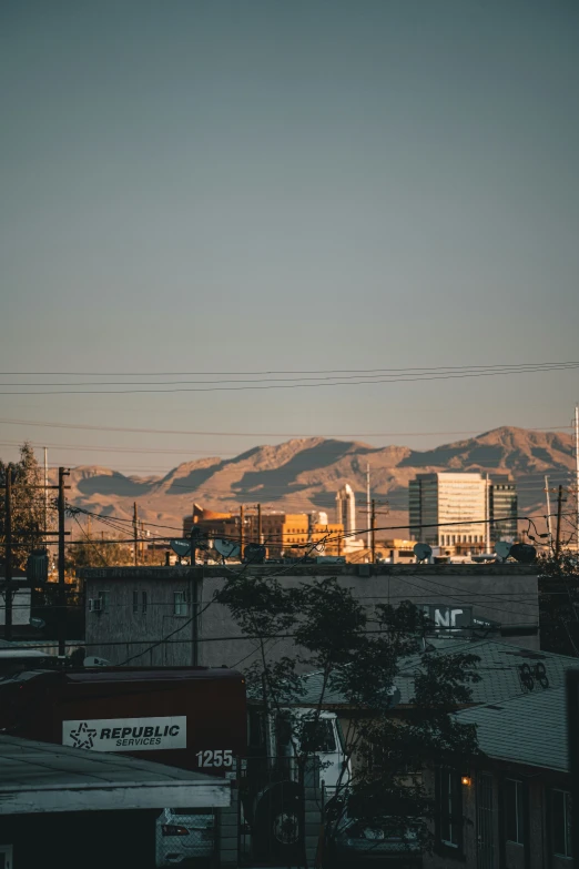 city skyline s, with hills and mountains in the background