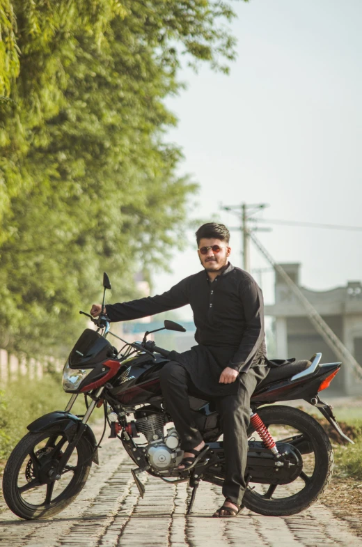 a man riding on the back of a motorcycle