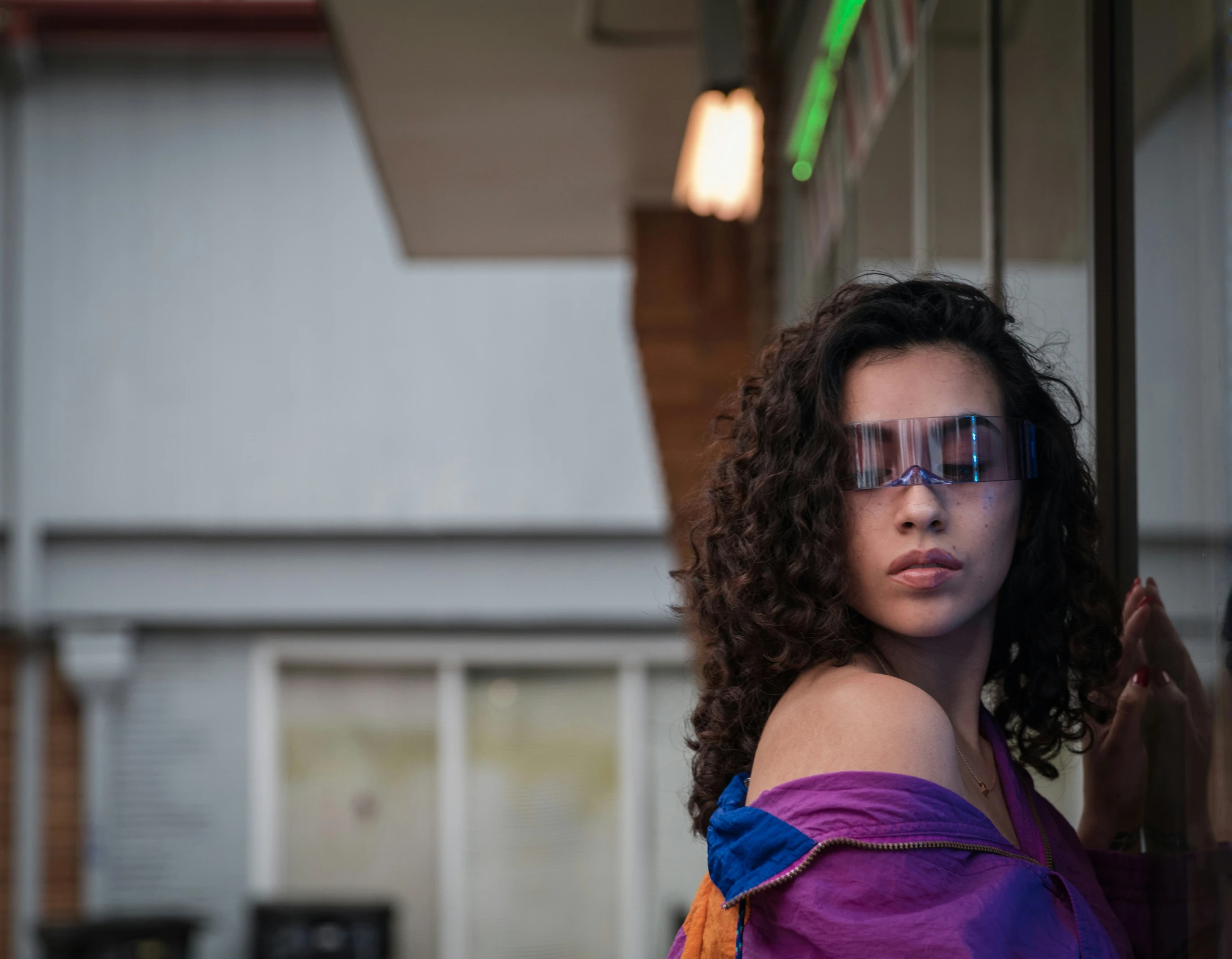 a woman with painted words and glasses behind glass