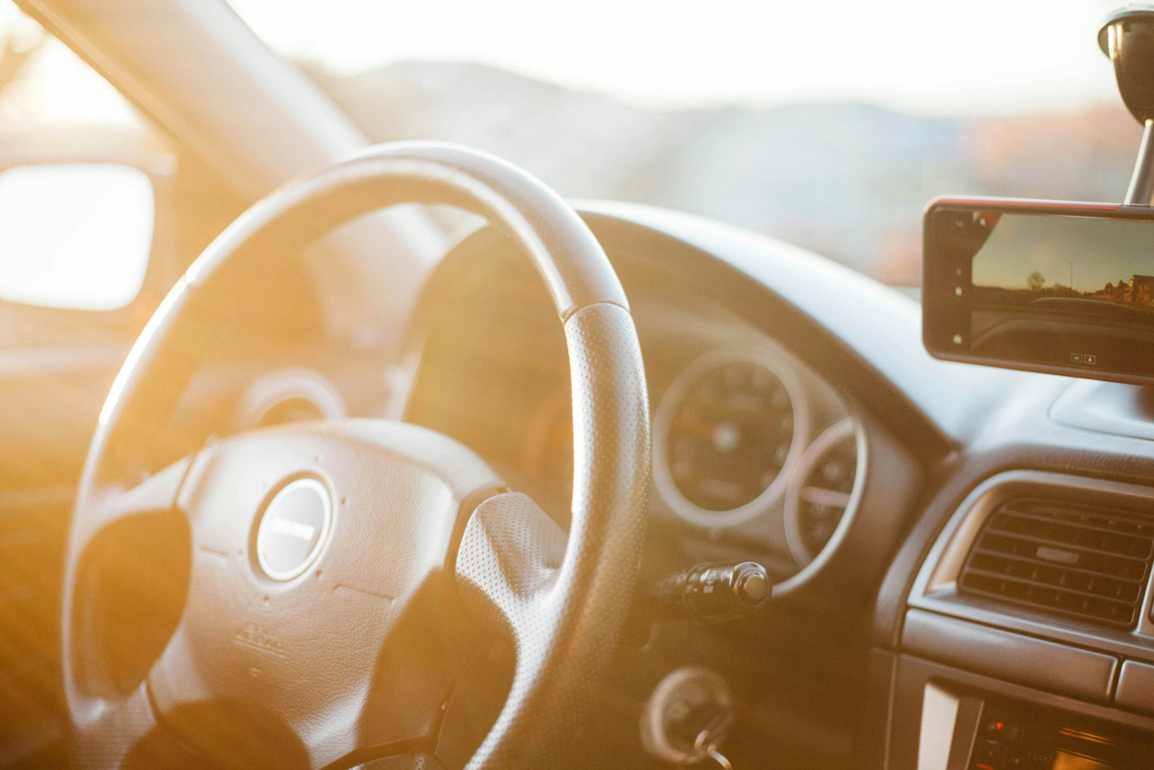 the view from behind a vehicle of the driver's dashboard