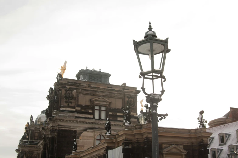 a street light sitting on the side of a road