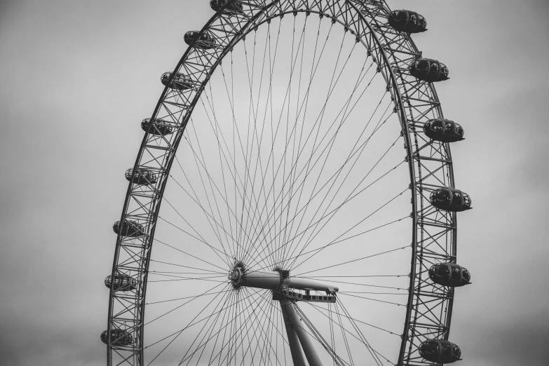 an empty ferris wheel with birds on the top