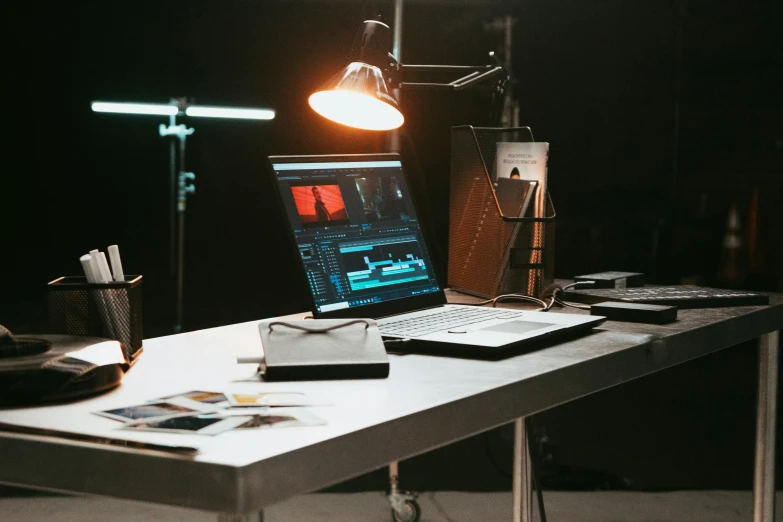 a laptop computer on a table with lights