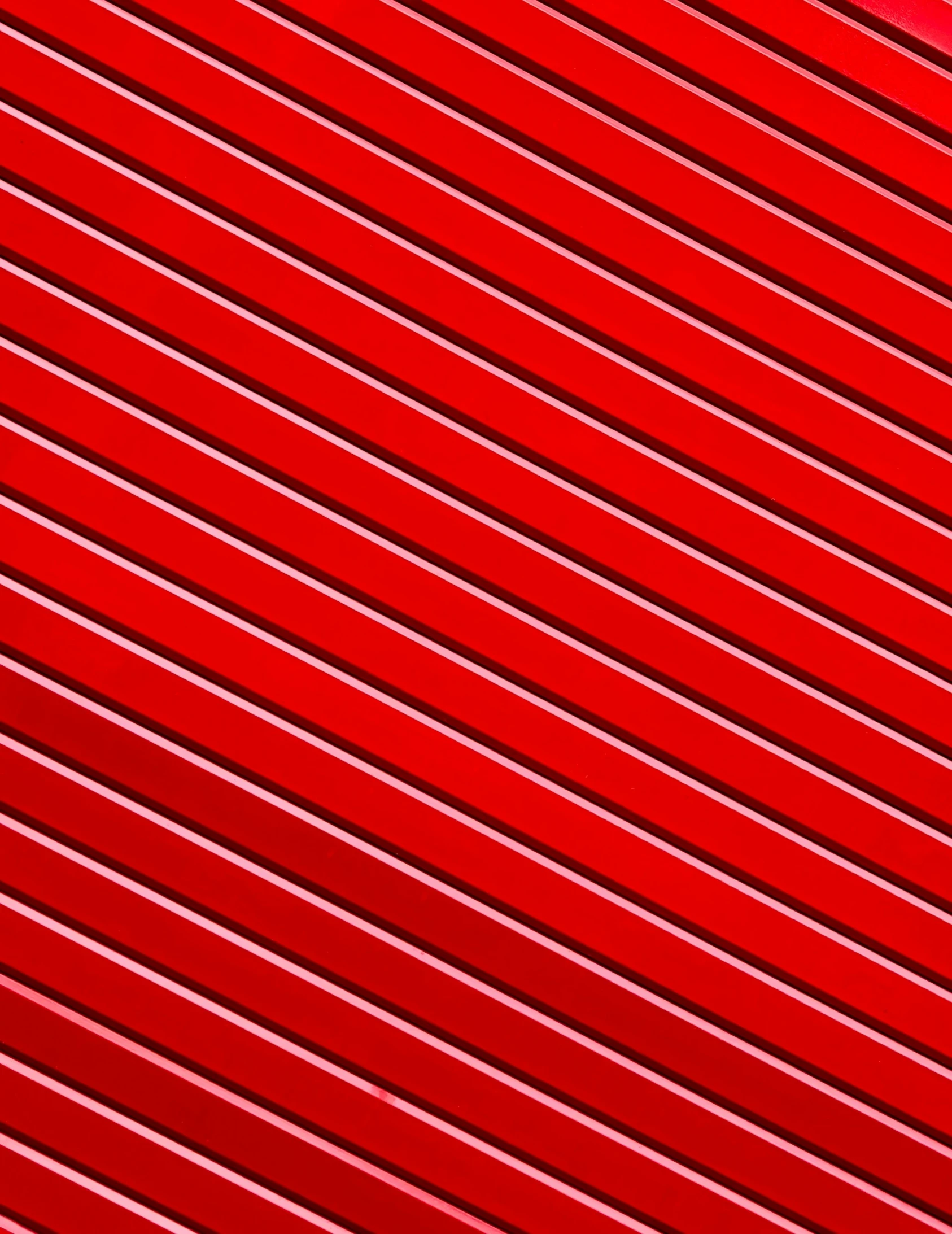 a red, wavy material has a bright green background