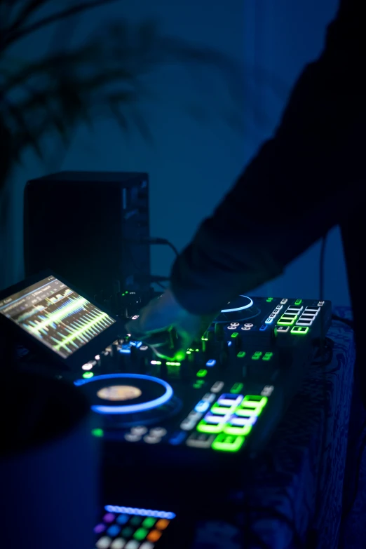 an image of electronic music mixing equipment in a room