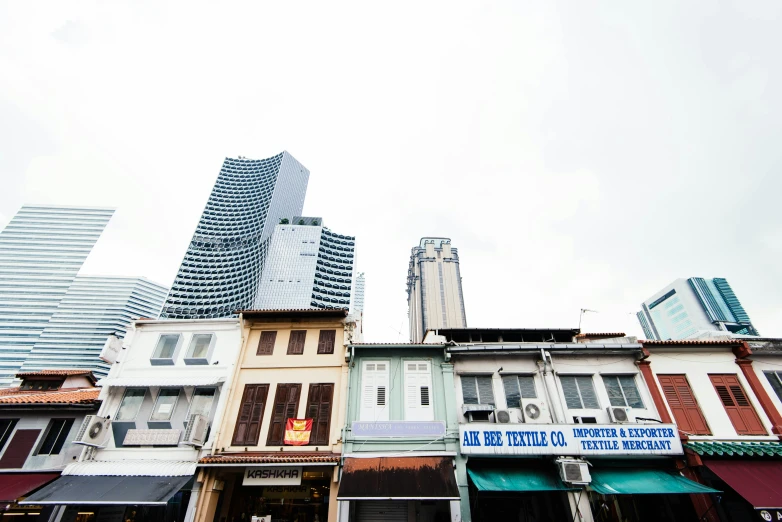 several buildings on a street with buildings behind them