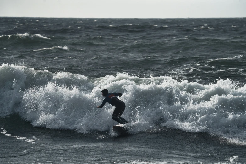 a person that is on a surfboard in the water