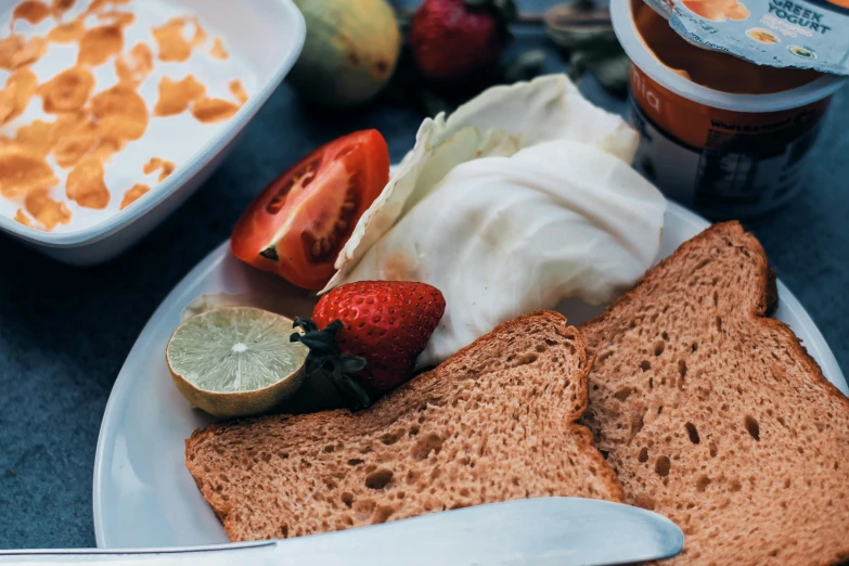 two slices of bread with strawberries on top