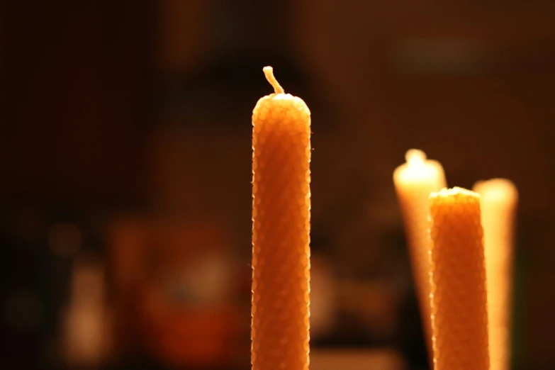 a couple of candles that are next to each other