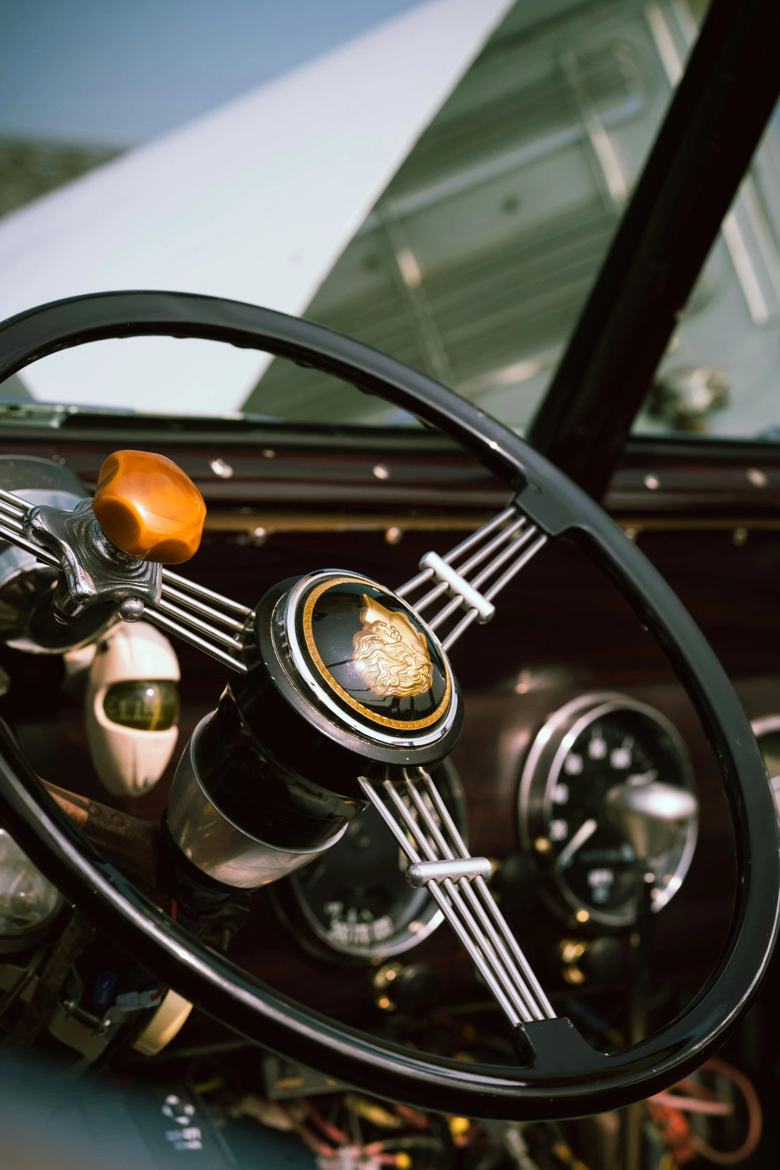 dashboard s of vintage car with steering wheel and instrument