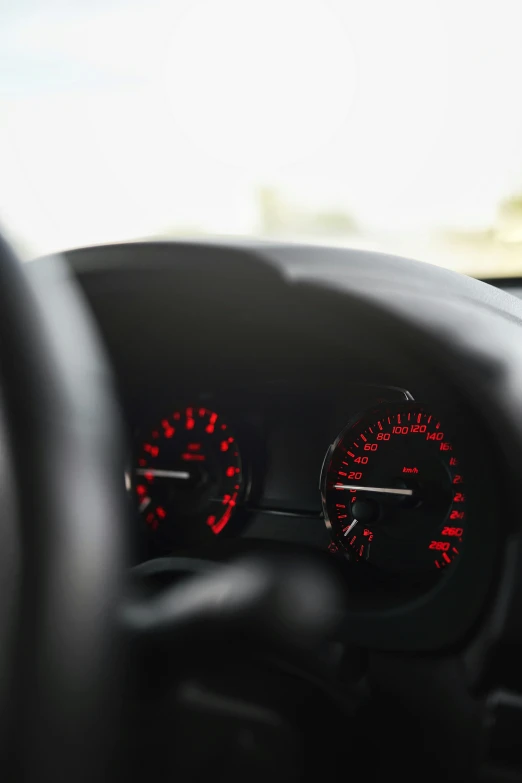 there are three red dash lights on the dashboard of a car