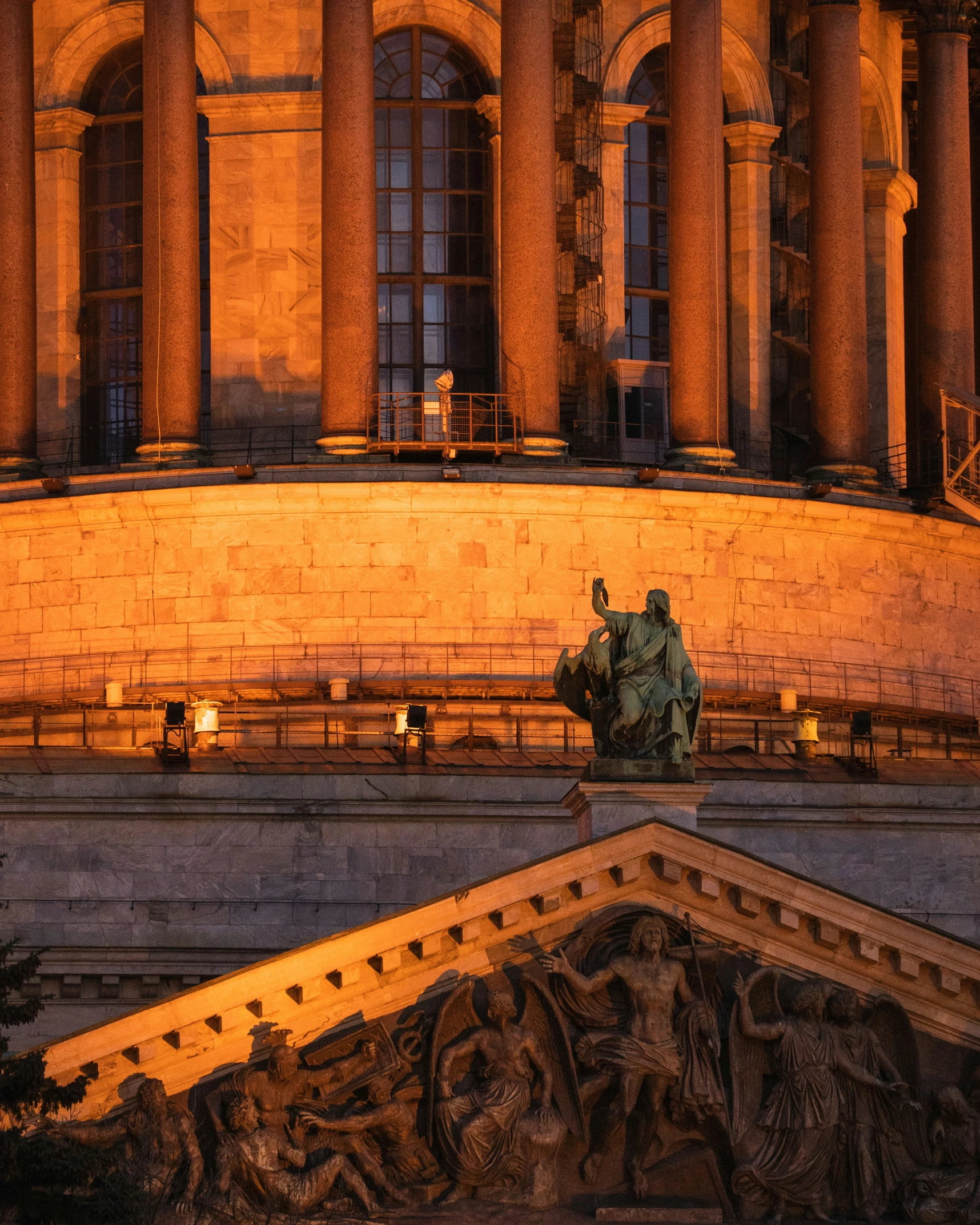 statue in the center of a huge building at night